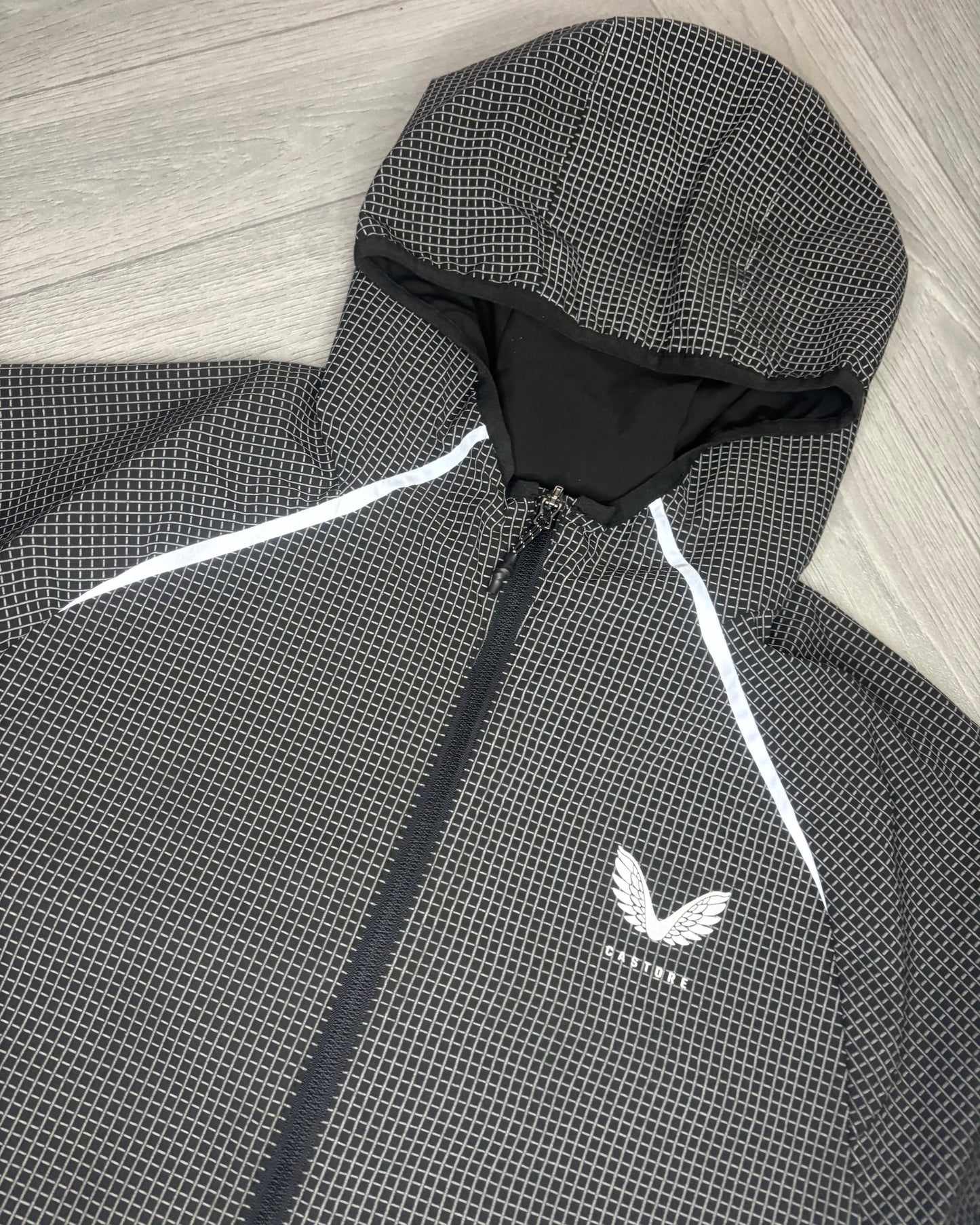 Castore Reflective Grid Lightweight Jacket (S)